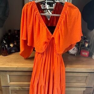 Orange tiered maxi with drape sleeves, open back